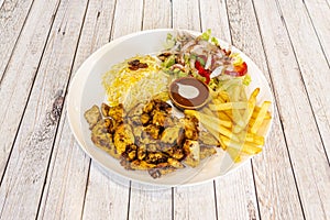 Chicken shawarma plate with pilau rice, potatoes fries and turkish salad