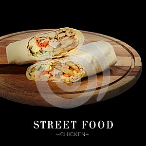 Chicken shawarma sandwich isolated on black background ready food banner with text space