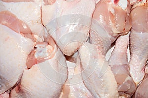 Chicken shins, thighs and wings.Background of raw fresh chicken.