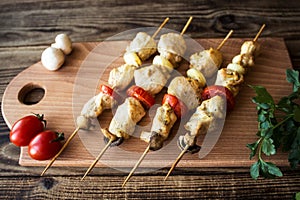 Chicken shish kebab with tomato and mushroom barbecue