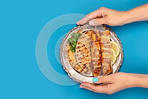 Chicken skewers souvlaki on color background