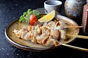 Chicken skin grilled or torikawa yakitori.