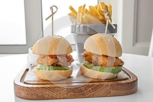 Chicken Sliders with french fries and mayo dip served in a dish isolated on grey background top view