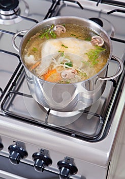 Chicken soup being cooked