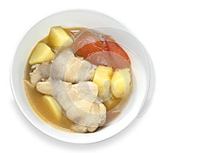 Chicken soup with potato isolated on white background with clipping path