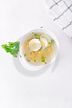 Chicken soup with vermicelli and boiled eggs