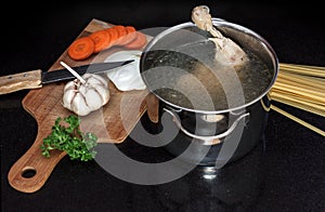 Chicken soupwith fresh vegetables, noodles and beans