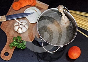 Chicken soupwith fresh vegetables, noodles and beans