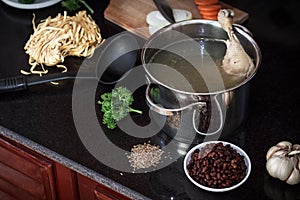 Chicken soupwith fresh vegetables, noodles and beans