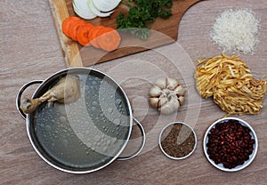 Chicken soupwith fresh vegetables, noodles and beans