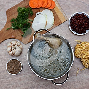 Chicken soupwith fresh vegetables, noodles and beans