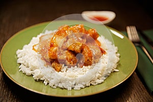 chicken in sour sweet sauce with crumbly white rice