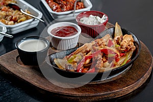 Chicken steak fajita with sauces on table stock photo