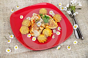 Chicken steak, fried potato basket and spring season flowers