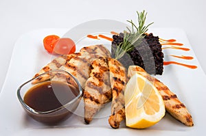 Chicken steak, fried rice and vegetable.