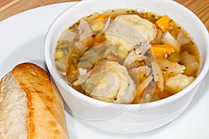 Chicken stew and dumplings. Hot winter comfort food close up photo