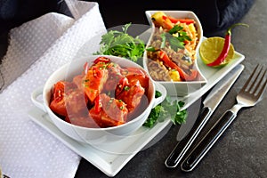 Chicken stew with pineapple and chili tomato sauce in a white bowl