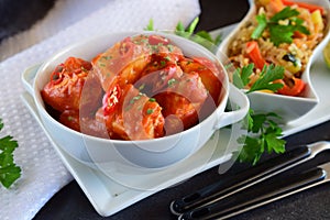 Chicken stew with pineapple and chili tomato sauce in a white bowl