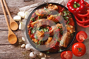 Chicken stew with vegetables on a table close-up. horizontal top photo