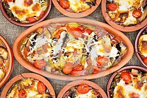 Chicken Stews in stoneware cups served together on the table photo