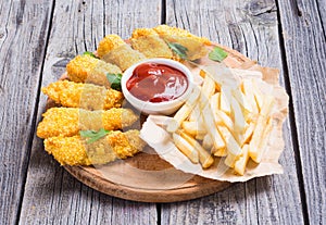 Chicken strips and French fries photo