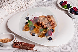 Chicken teriyaki sauce with raspberry and blueberry, quenelle of orange, natyumorort