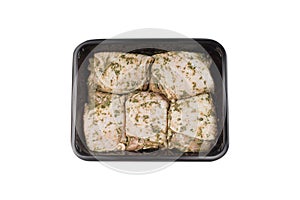 Chicken thighs in spices. Chicken meat package isolated on a white background.Raw Chicken Meat Supermarket Tray Supermarket Meat