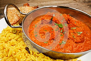 Chicken tikka masala in balti dish with rice