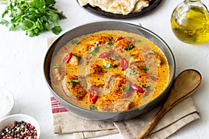 Chicken tikka masala curry with herbs and peppers. Indian food. National cuisine