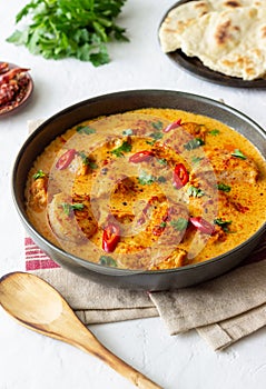 Chicken tikka masala curry with herbs and peppers. Indian food. National cuisine