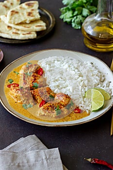 Chicken tikka masala curry with rice, herbs and peppers. Indian food. National cuisine