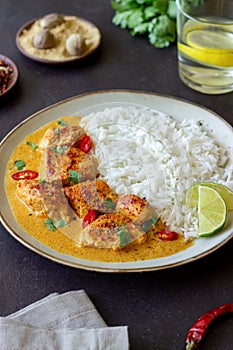 Chicken tikka masala curry with rice, herbs and peppers. Indian food. National cuisine