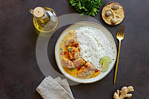 Chicken tikka masala curry with rice, herbs and peppers. Indian food. National cuisine