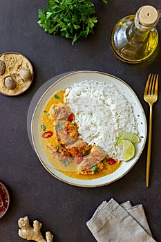 Chicken tikka masala curry with rice, herbs and peppers. Indian food. National cuisine