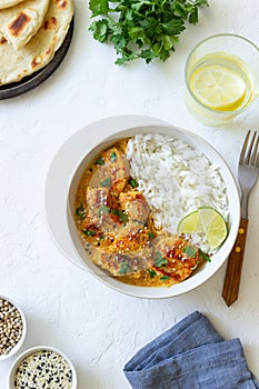 Chicken tikka masala curry with rice, herbs and peppers. Indian food. National cuisine