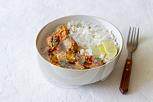 Chicken tikka masala curry with rice, herbs and peppers. Indian food. National cuisine