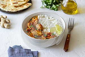 Chicken tikka masala curry with rice, herbs and peppers. Indian food. National cuisine