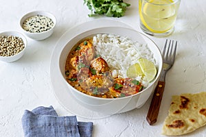 Chicken tikka masala curry with rice, herbs and peppers. Indian food. National cuisine