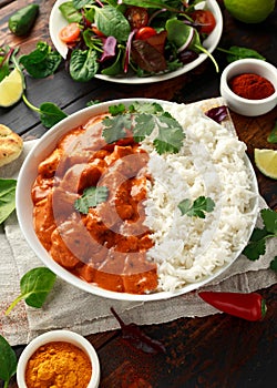 Chicken tikka masala curry with rice and naan bread