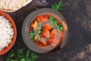 Chicken tikka masala with rice. Asian-Indian dish. Top view, copy space.