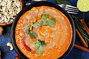 Chicken tikka masala spicy curry meat food in pot with rice and naan bread. indian food