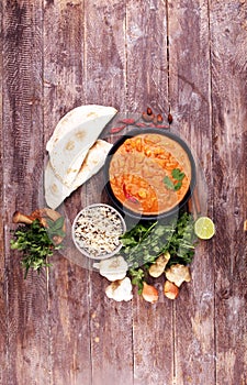 Chicken tikka masala spicy curry meat food in pot with rice and naan bread. indian food