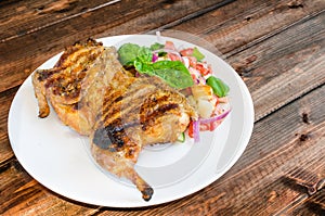 Chicken under a brick with panzanella salad