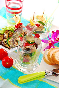 Chicken and vegetable skewers served in glass