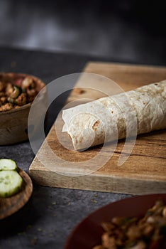 Chicken and vegetables durum or burrito on a table