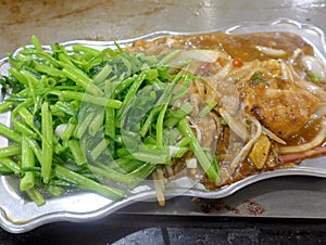 Chicken with vegetables on hot plate,teppanyaki cooking
