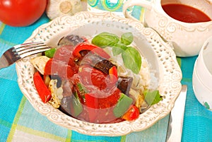 Chicken and vegetables in tomato sauce with rice