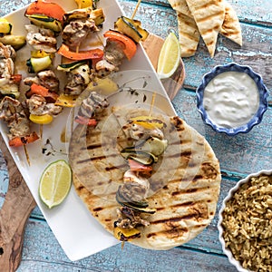 Chicken and veggie kebabs served with grilled naan bread and tzatziki dip.