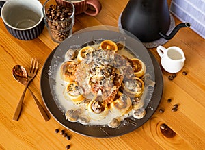 Chicken Waffle with Mushroom Milk with coffee beans, fork, spoon served in dish isolated on wooden table top view of taiwan food