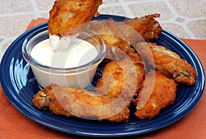 Chicken Wing Being Dipped